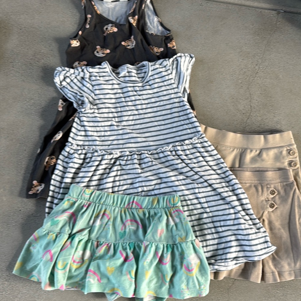 Girls size 6 bundle. Includes 2 uniform skirts, 2 dresses and a skort.